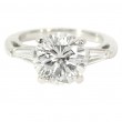 Platinum Three-Stone Diamond Engagement Ring. with 2.69 Carat Center.