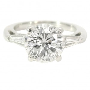 Platinum Three-Stone Diamond Engagement Ring. with 2.69 Carat Center.