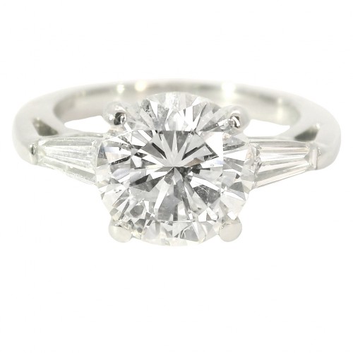Platinum Three-Stone Diamond Engagement Ring. with 2.69 Carat Center.