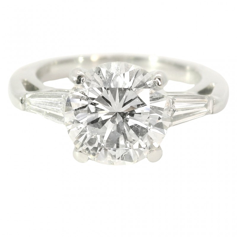 Platinum Three-Stone Diamond Engagement Ring. with 2.69 Carat Center.
