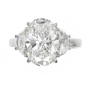 Platinum 3-Stone Oval Cut Diamond Engagement Ring with Half-Moon Cut Side Stones